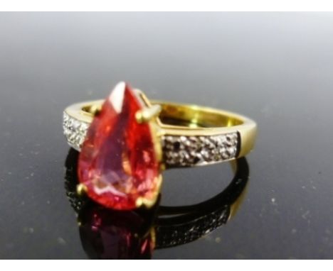 AN 18CT GOLD RING set with a pink sapphire 