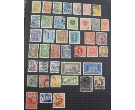 A STANLEY GIBBONS BLACK BOUND RING ALBUM with collection of world stamps including some better items 