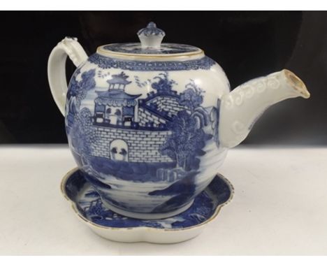 AN EARLY 19TH CENTURY CHINESE PORCELAIN TEAPOT having scroll moulded handle and spout, the cover with floral knop, hand paint