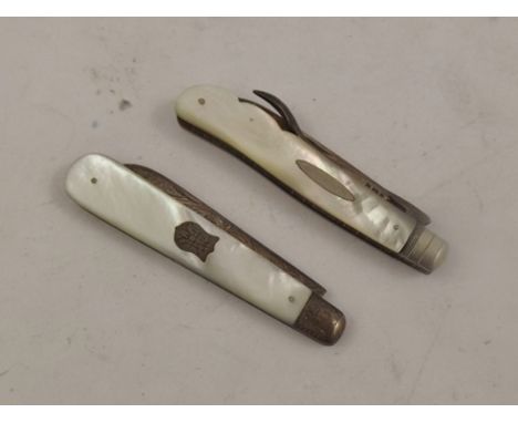 TWO VICTORIAN SILVER AND MOTHER OF PEARL MOUNTED FRUIT KNIVES one with engraved blade and cartouche, Arthur Staniforth, Sheff