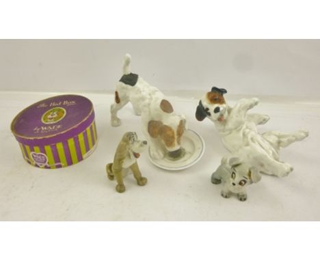 TWO ROYAL DOULTON EARTHENWARE PUPPIES, one licking from a plate, HN1158, the other back scratching, HN1098 and two WADE MODEL