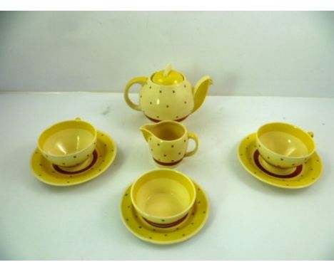 A MID 20TH CENTURY SUSIE COOPER EARTHENWARE TEASET decorated in banded yellow and brown and brown crosses, comprising; teapot