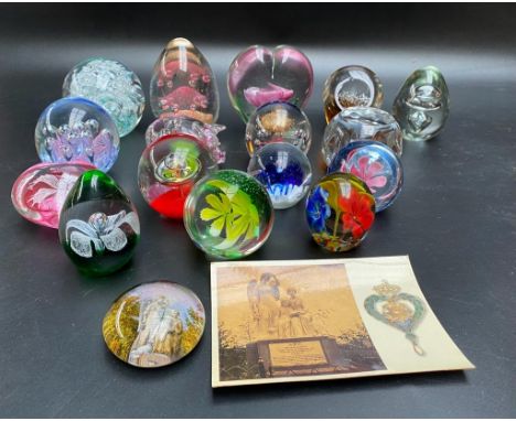 A collection of various paperweights to include Marcaret virgin Martyr of the ocean wave monument paperweight 