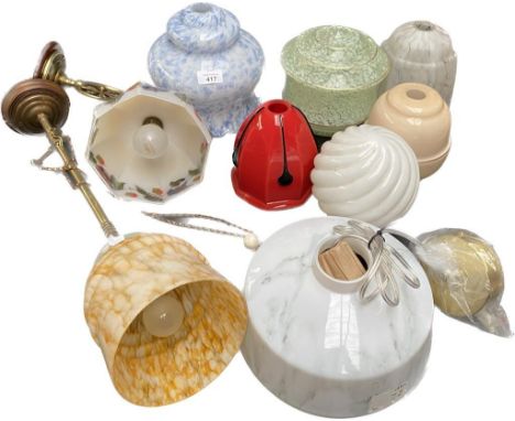 A collection of Vintage glass light shades includes art deco glass shades, Brass and art deco design ceiling light, red and b
