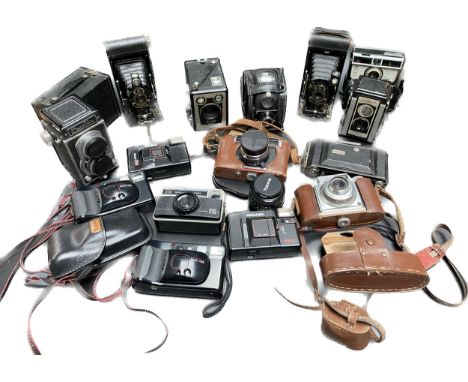 A large collection of vintage cameras; crystar camera, bellows cameras and Kodak made cameras 