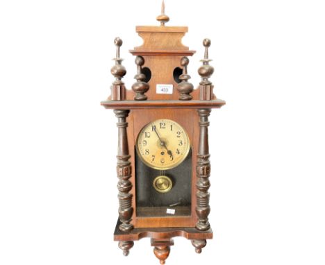 Antique wall clock; Mahogany casing, comes with key and pendulum. [74cm high] 