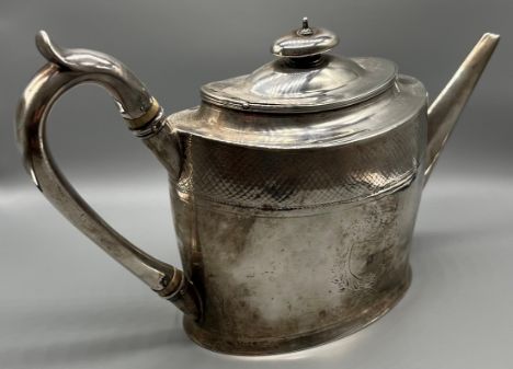 George III London silver teapot- Robert Jones, London 1796, of oval outline, with bright cut engraved decoration and a vacant