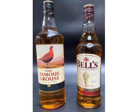 A bottle of famous grouse scotch whisky &amp; A bottle bells blended scotch whisky. 