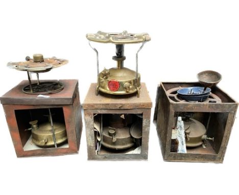 A collection of vintage paraffin stoves includes primus 