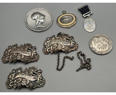 A Selection of silver items; Three raised relief Georgian Birmingham silver drinks labels, Silver medallion medal- 'Society o