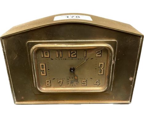 An antique french brass travel clock [in a working order] [9.5cmx14cm] 
