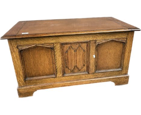 Oak chest, the lift up surface opening to interior storage, the front with moulded panel design [49x92x49cm] 