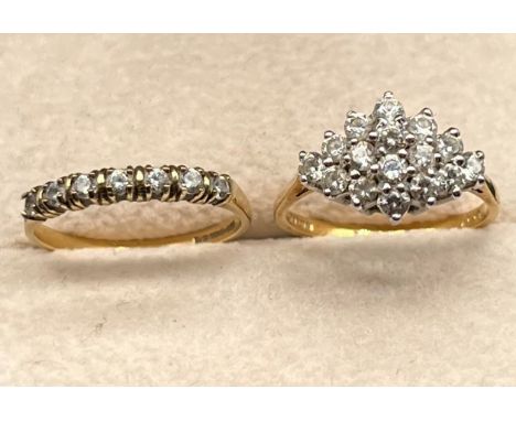 Two 9ct yellow gold earrings fitted with CZ Stones. [3.80grams] [Ring size K &amp; L] 