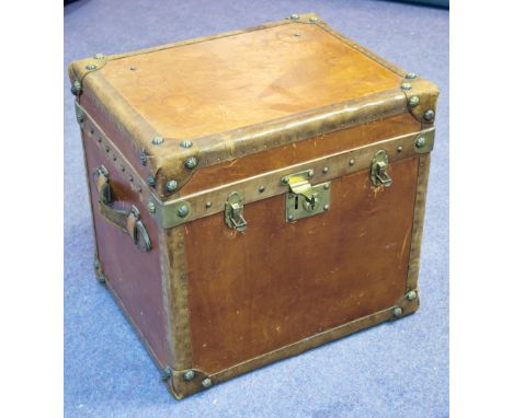 TRUNK, vintage tan leather and brass studded with hinged top and side handles, 51cm H x 55cm W x 45cm D. (with faults)
