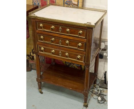 TABLE EN CHIFFONIERE, Directoire mahogany with brass gallery, marble top, fitted three drawers, 52cm W x 34.5cm D x 77cm H. (