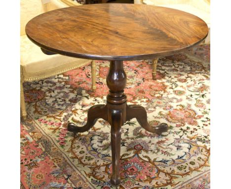 TRIPOD TABLE, George III mahogany with circular tilt top on turned shaft and brass castors, 74cm H x 86cm D.