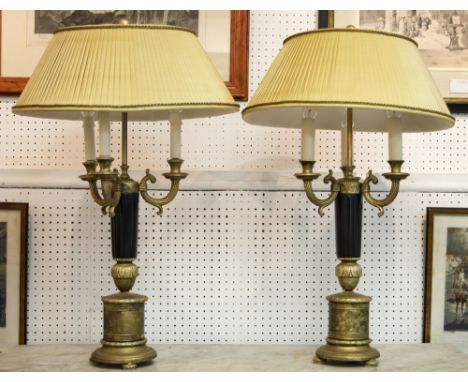 TABLE LAMPS, a pair, Empire style, gilt metal and black marble, each with three lights and cream pleated shade, 76cm H x 47cm