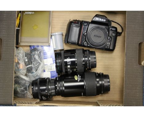 A Nikon F-601 Camera, with various lenses and accessories including AF f/1.8 50mm (a lot)