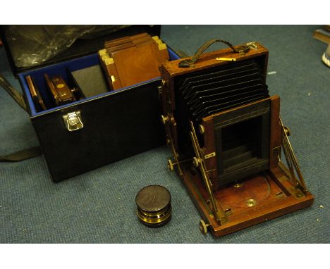 A Sands Hunter & Co. Mahogany Half Plate Field Camera,  with two brass lenses, Thornton Pickard shutter, and three brass boun
