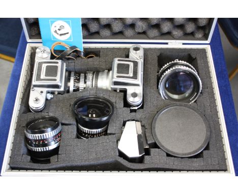 A Pentacon Six TL Camera, together with a Praktisix camera, with various lenses in aluminium case (a lot)