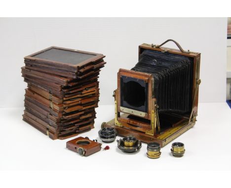 A Mahogany Half Plate Field Camera, by The Midland Camera Company, together with four lenses, two brass, and DDS (a lot)