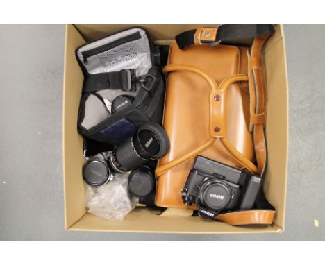 Nikon equipment, Nikon FM2 camera with a quantity of Nikon lenses and a large brown leather Nikon outfit case (a lot)
