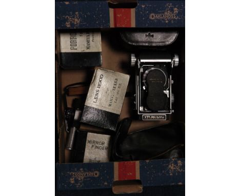 A Mamiya TLR Camera, with various lenses and accessories, some boxed (a lot)