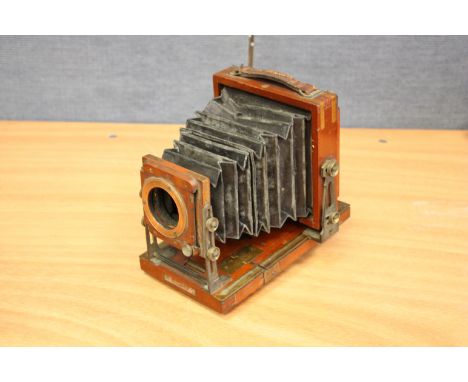 An Un-Marked Mahogany Quarter Plate Tail Board Camera, lacking lens