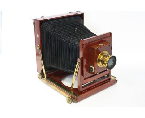 A Thornton Pickard Imperial Perfecta Mahogany Camera, with two brass lenses, two DDS, and tripod (a lot)
