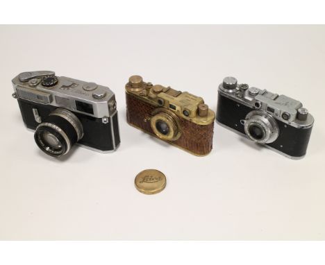 A Canon Model 7 Rangefinder Camera, with f/1.8 50mm, together with a Leica II Luxus replica, and a Fed (3)