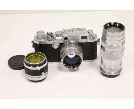 A Canon IID Camera with Lenses: a chrome body with an f/1.8 50mm Canon lens, another example together with an f/4 135mm Seren