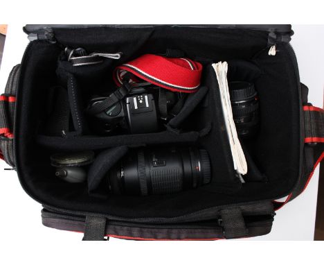 a Canon Eos 750 camera with lenses, A Canon Eos 750 camera with an f/3.5-4.5 35-70 lens and an f/4 70-200 lens in bag