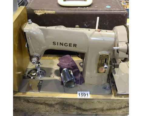 Vintage cased electric Singer sewing machine, Serial number K10569791. Not available for in-house P&amp;P, contact Paul O'Hea