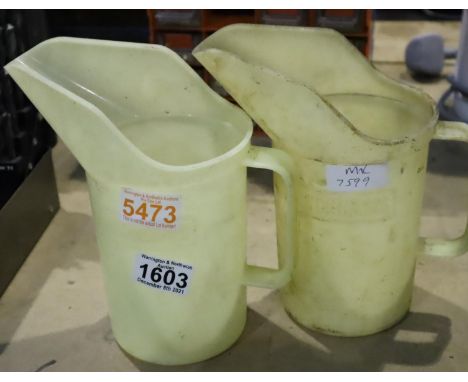 Two vintage Duckhams one quart oil poring jugs. Not available for in-house P&amp;P, contact Paul O'Hea at Mailboxes on 01925 