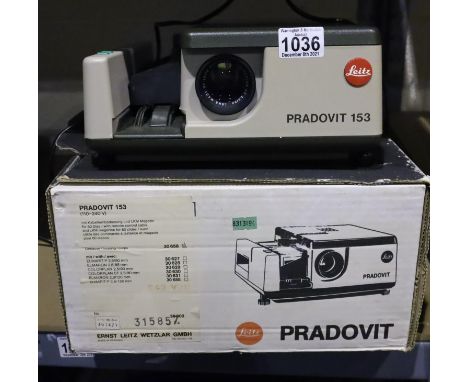 Boxed Leitz Pradovit 153 projector. P&amp;P Group 3 (£25+VAT for the first lot and £5+VAT for subsequent lots) Condition Repo