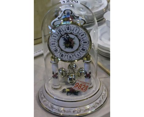 Ceramic based anniversary clock with glass dome, requires battery. Not available for in-house P&amp;P, contact Paul O'Hea at 