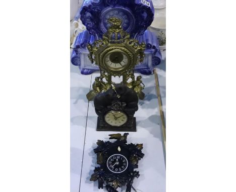 Four mixed clocks to include a large ceramic example. Not available for in-house P&amp;P, contact Paul O'Hea at Mailboxes on 