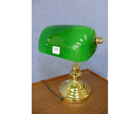 A brass student's desk lamp