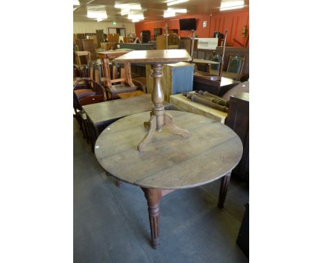 A French oak dining table, Victorian mahogany tripod table and one other