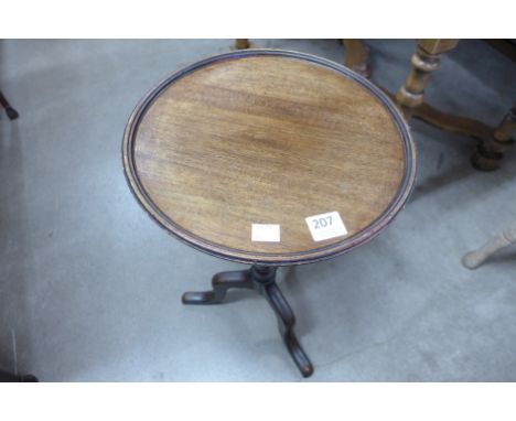 A mahogany tripod wine table