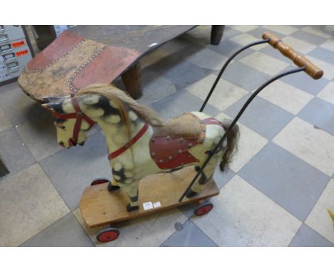 A vintage child's toy pull along horse