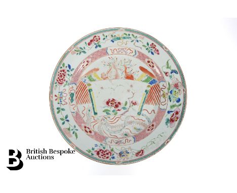 A large Chinese famille rose dish, Qianlong period, set in the centre with an open scroll panel decorated with peony enclosed
