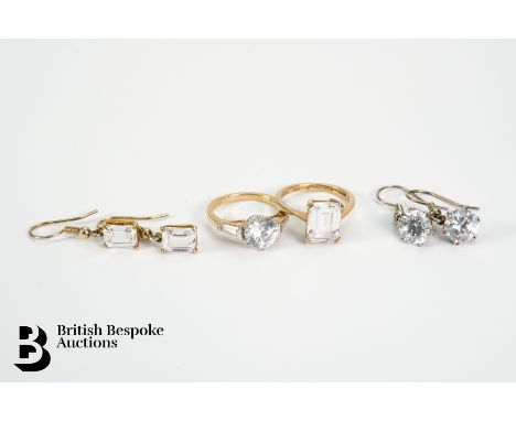Two 9ct gold CZ rings, size K (circular) and size L (emerald cut), together with two pairs of 9ct gold and silver (hoops) mat