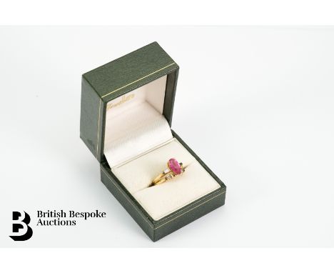 14ct Yellow gold pink tourmaline and diamond puzzle ring. The ring set with pear-shaped pink tourmaline measuring 10 x 5mm, f
