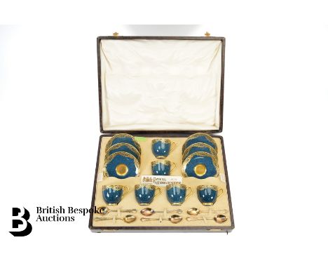 Cased Royal Worcester set, each piece having gilded decoration on a powder blue ground, puce factory marks to base, along wit