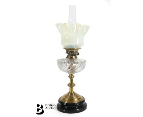 Victorian brass oil lamp, with a fluted Vaseline shade, clear glass reservoir and funnel, approx 55 cms h.&nbsp;&nbsp;