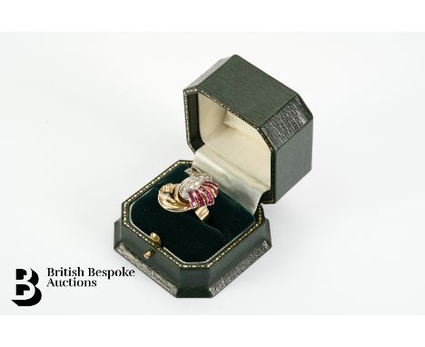18ct (tested) yellow gold ruby and diamond stylistic pill box ring. The ring set with 34 pts of 8 cut dias, and 18 rubies, si