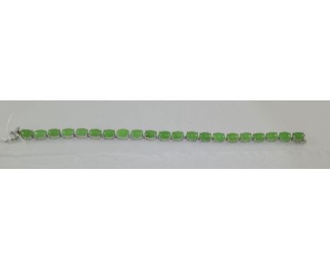 Green Jade Tennis Bracelet, oval cut cabochons of green jade, totalling over 40cts, set in platinum vermeil and silver, faste