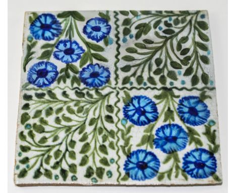 William De Morgan Floral Tile, the square divided into four panels, two opposing diagonally hand decorated with five cornflow