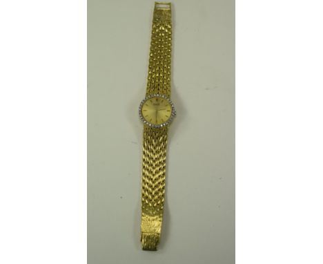 Piaget Ladies 18ct Yellow Gold Diamond Set Bracelet Watch. Circa 1970s. Champagne Dial, The Bezel is 'Factory Set' with 36 Di